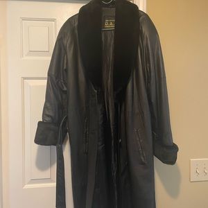 Leather full length coat with fake fur on cuffs neck line with buttons and belt